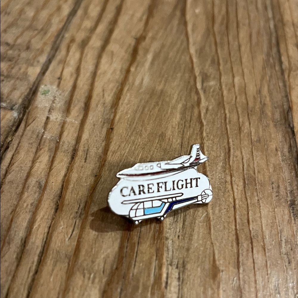 CARE FLIGHT Enamel Pin - White, Silver & Blue